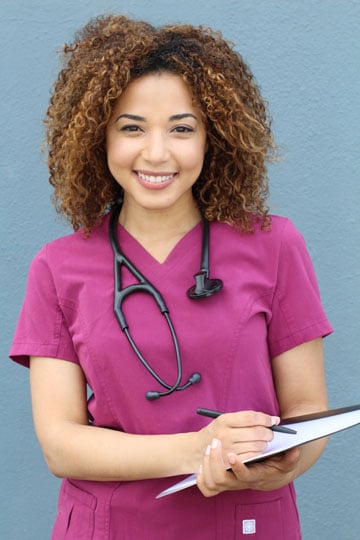 Allied health professional in scrubs smiling