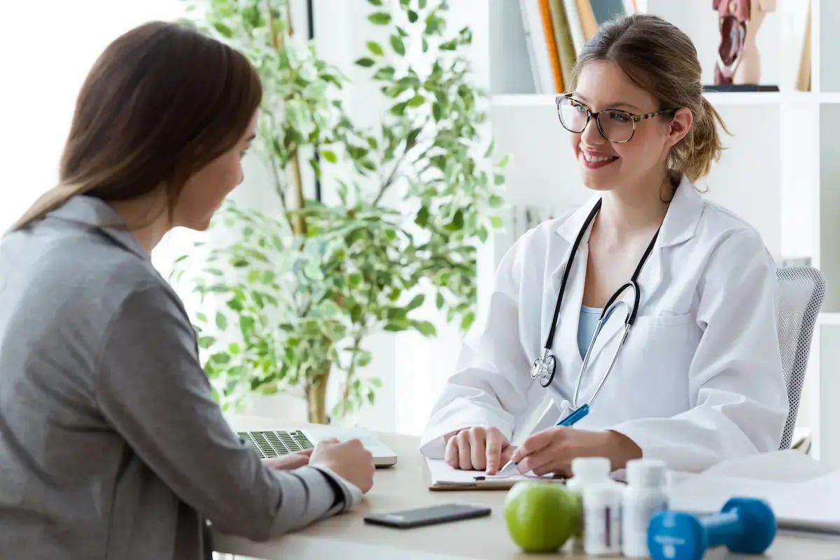 Dietician speaks with a patient at a desk