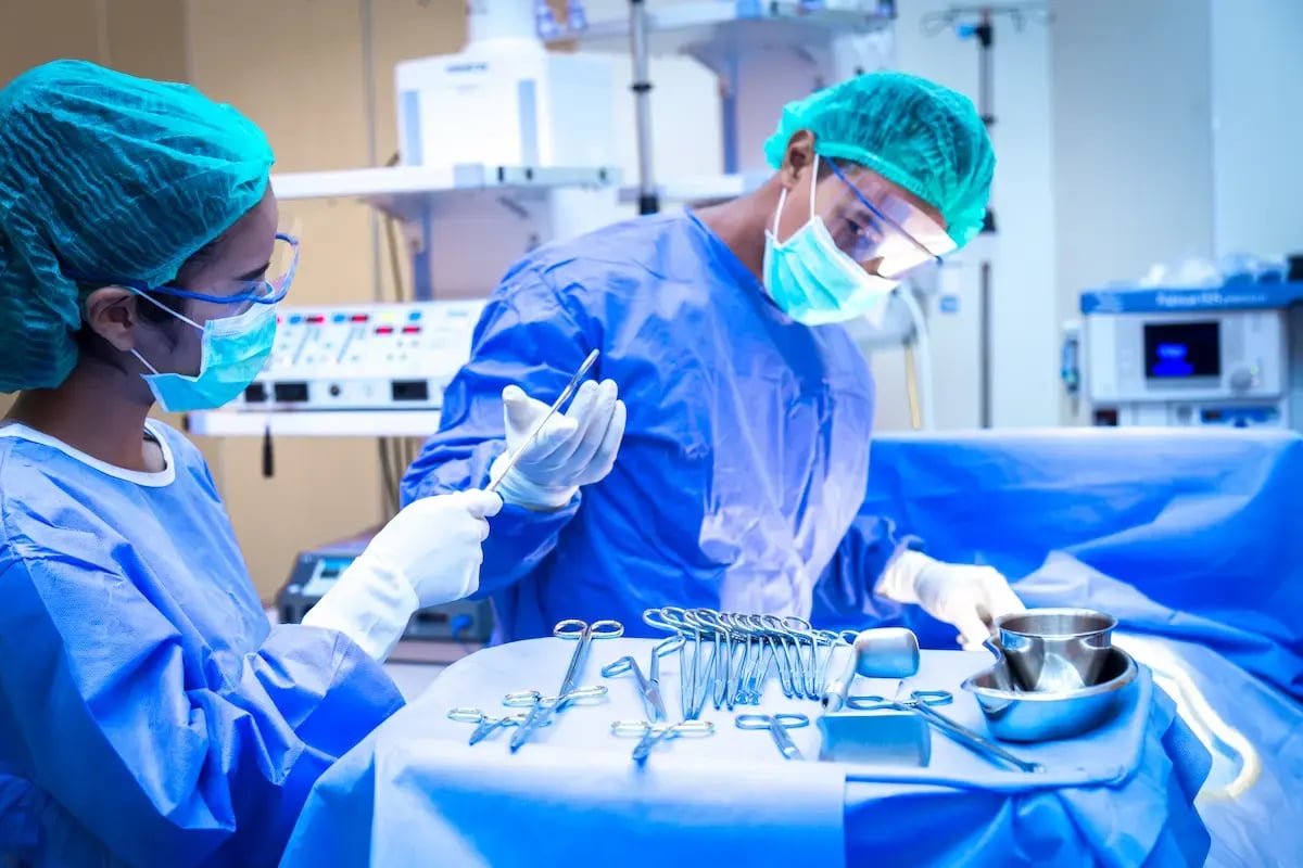Cardiovascular RN assisting a physician during surgery Cardiovascular RN assisting a physician during surgery