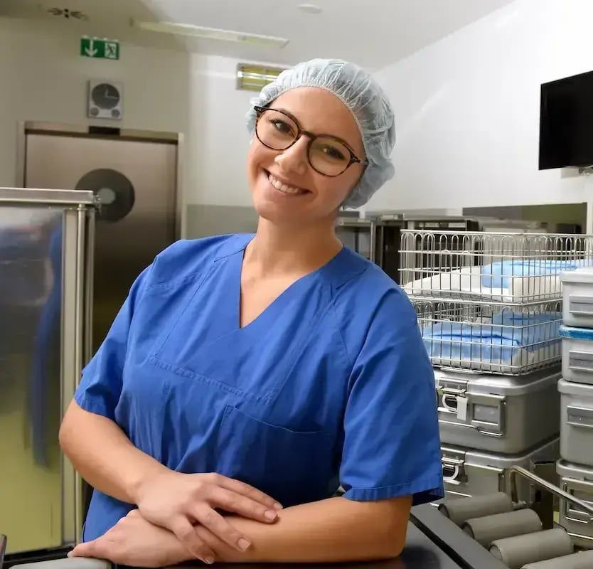 Sterile processing technician smiling while working