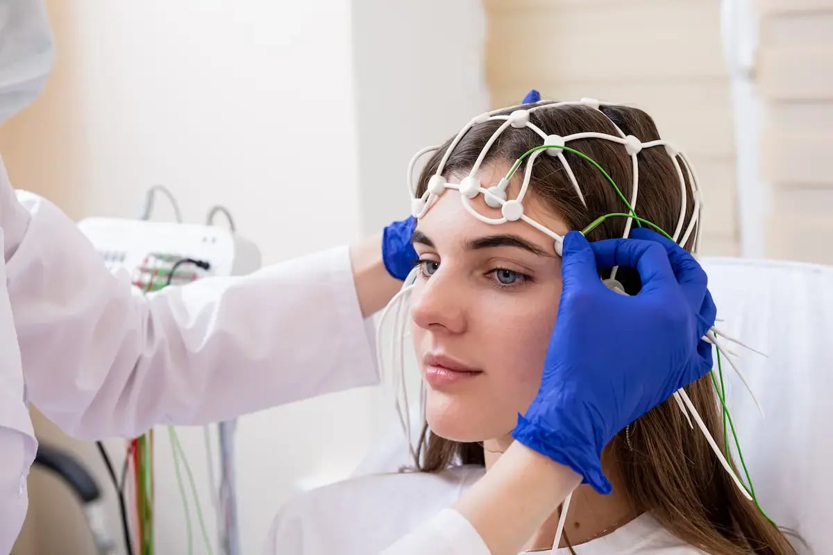 A patient getting EEG electrodes put on 