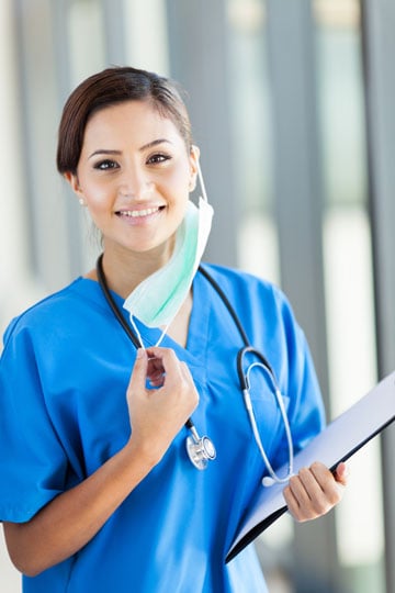 Nurse smiling while wearing a mask