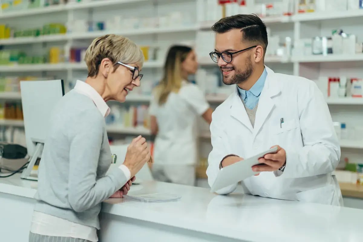 Pharmacist talking with a customer
