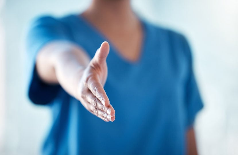 Per diem nurse holding out their hand