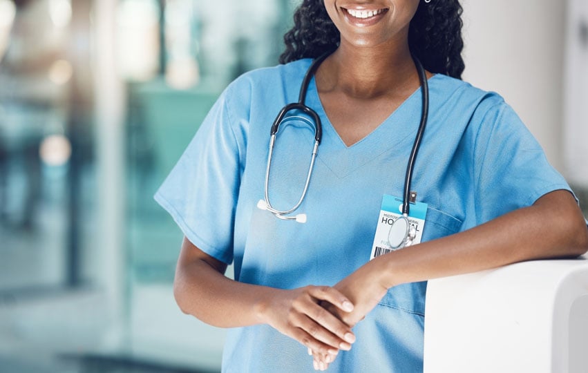Nurse smiling while working