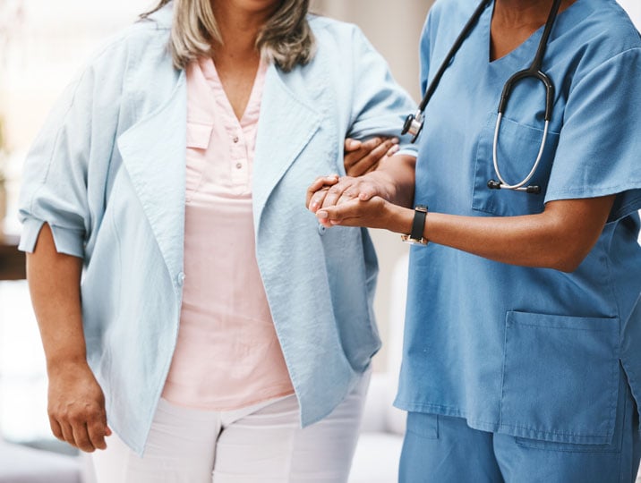 Emergency services nurse assisting a patient