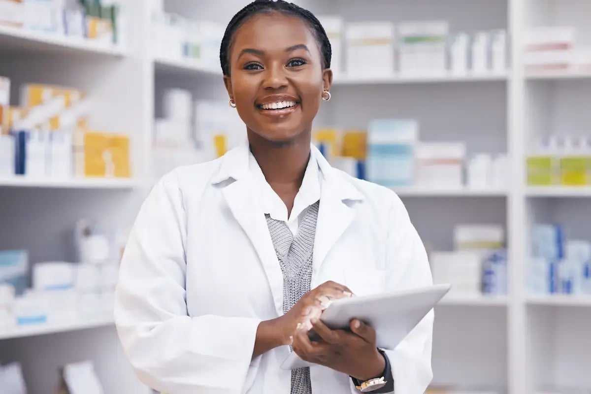 Pharmacist working in a hospital smiling