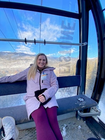 Travel RN sits in a ski lift near Denver, Colorado