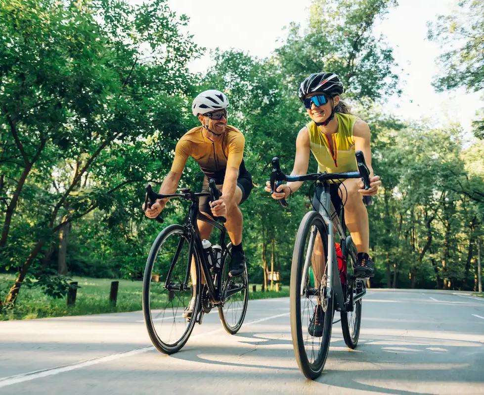 Two off duty LPNs riding their bikes in a park in their free time