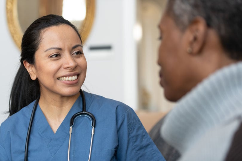 Nurse working with a patient