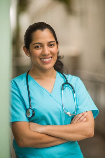 Nurse smiling wearing scrubs