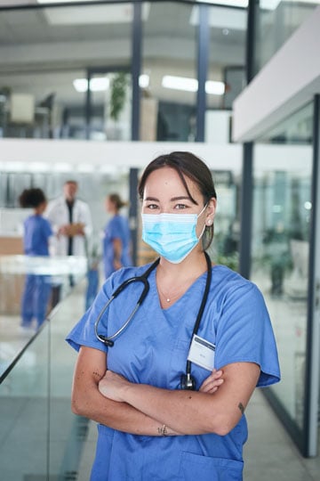 Per diem nurse smiling while wearing a mask