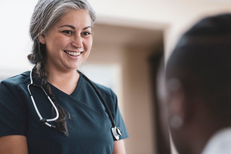 Nurse smiling at a patient