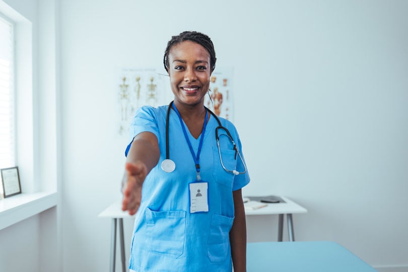 Direct hire nurse extending their hand