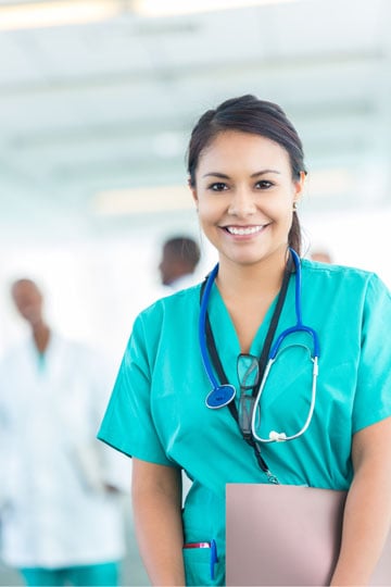 Nurse smiling while working in a hospital