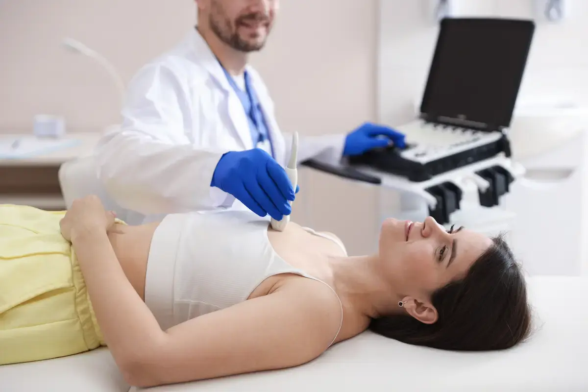Echo tech performing a ultrasound exanimation for a patient