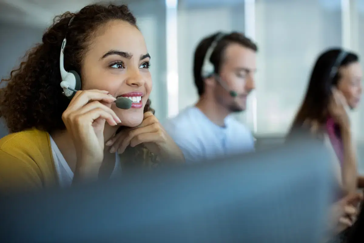 healthcare billing admin talking on a headset to a patient