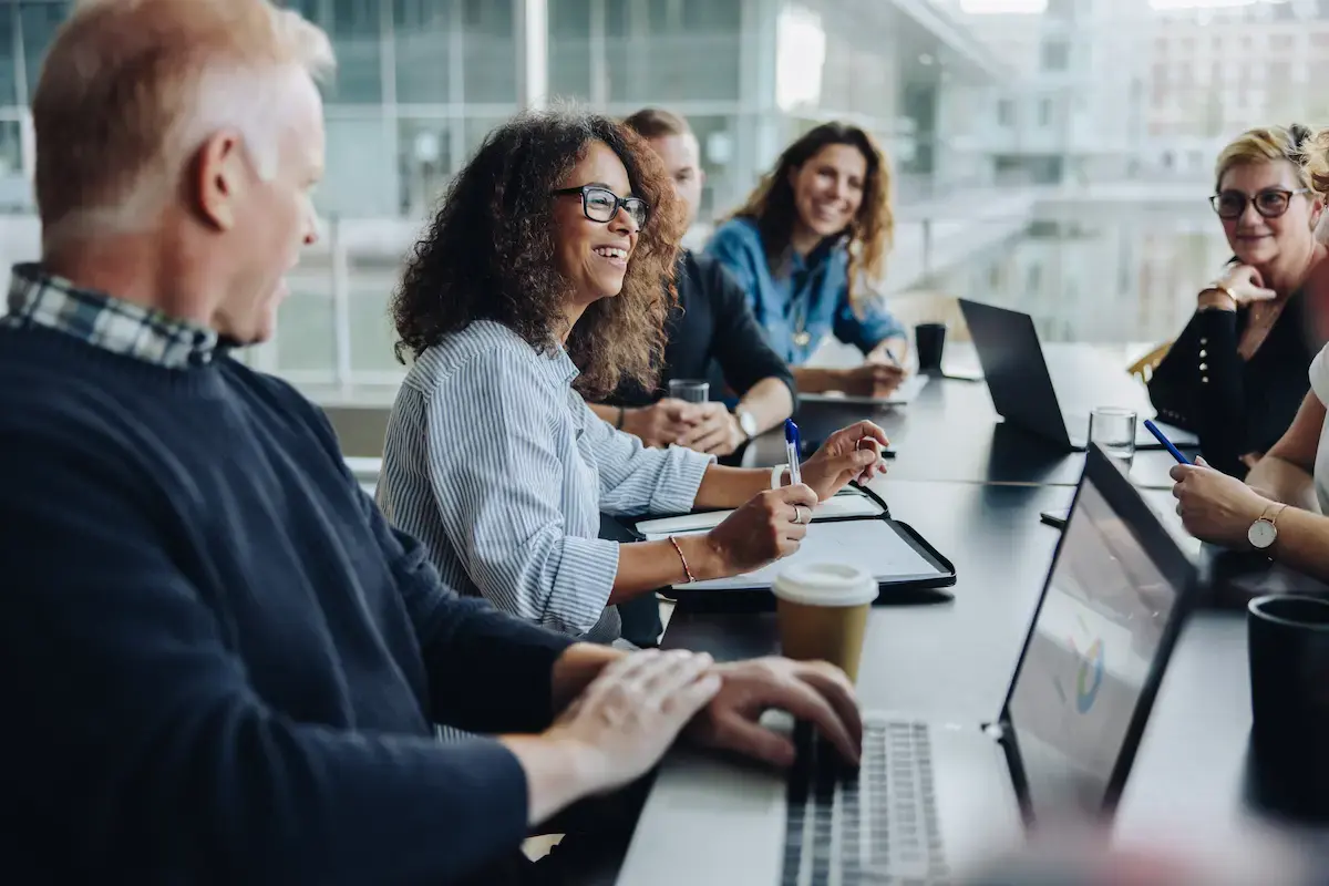 Hospital business professionals sitting at a table having a meeting