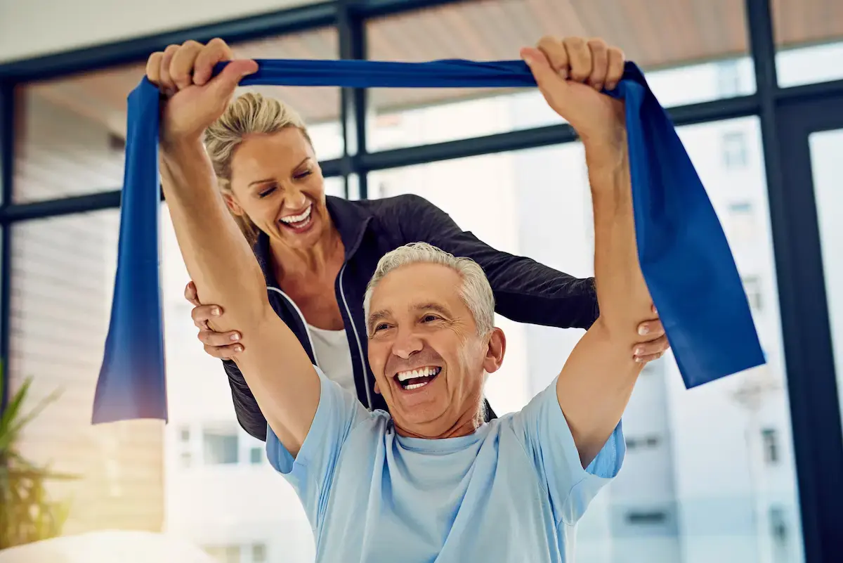 Physical therapist helps a patient with exercises