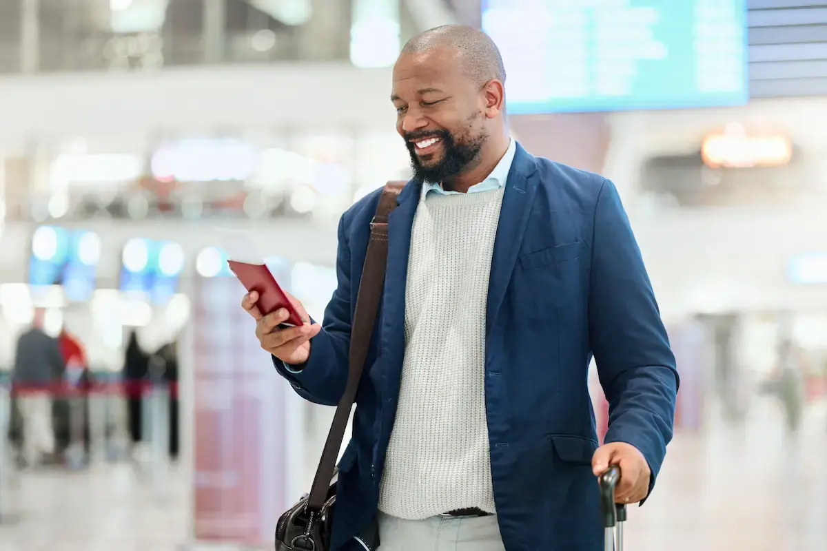 Non-clinical healthcare worker in the airport traveling to his next assignment