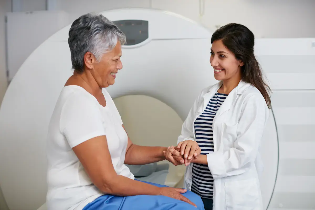 Physician speaking to a patient at the MRI machine