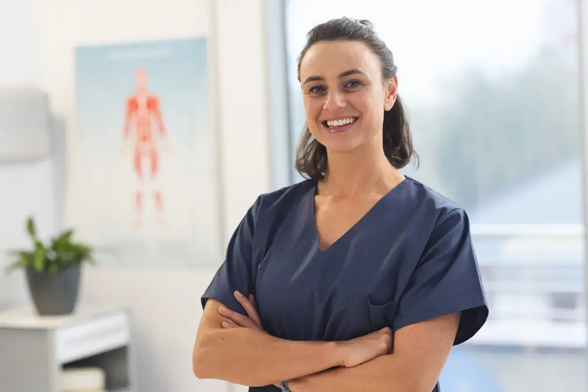 Physical therapist crossing her arms and smiling