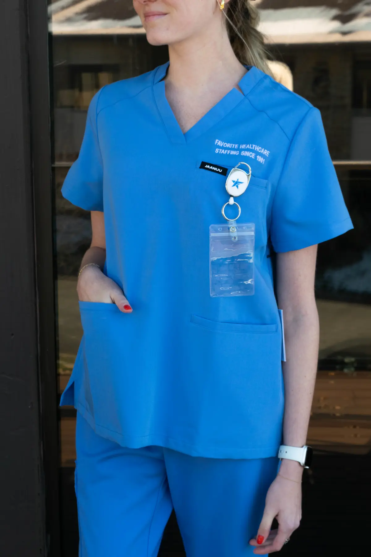 Nurse wearing a Favorite branded pair of scrubs